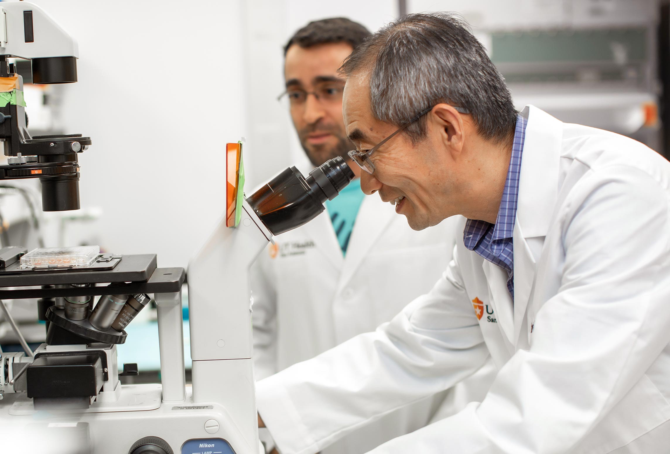 Dr. LuZhe Sun doing research in a laboratory 