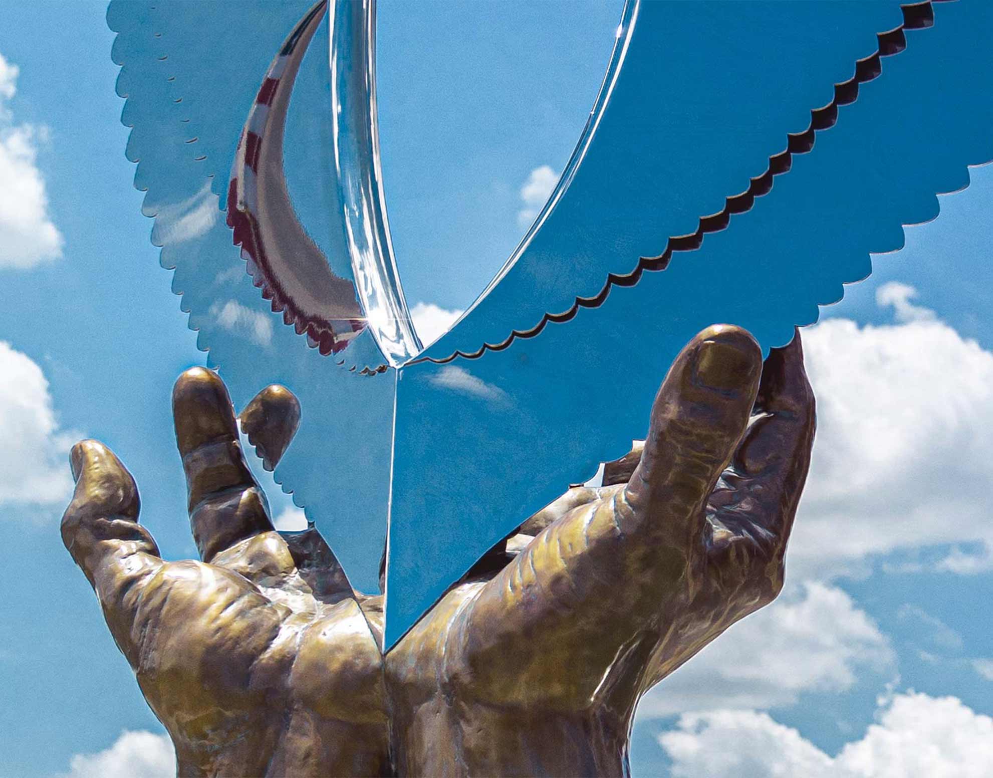 wings of hope, hands of healing sculpture