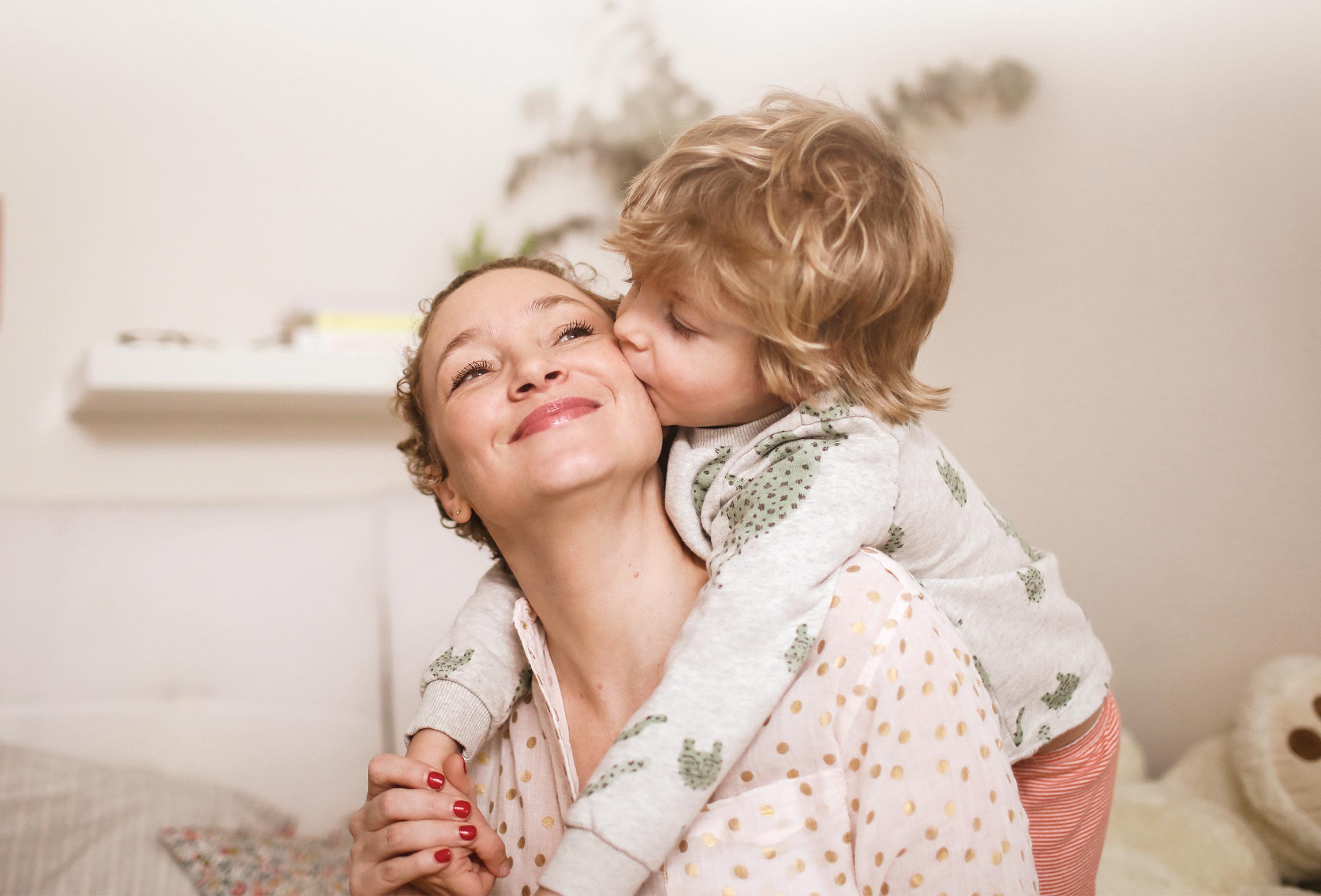 Mother and son hug