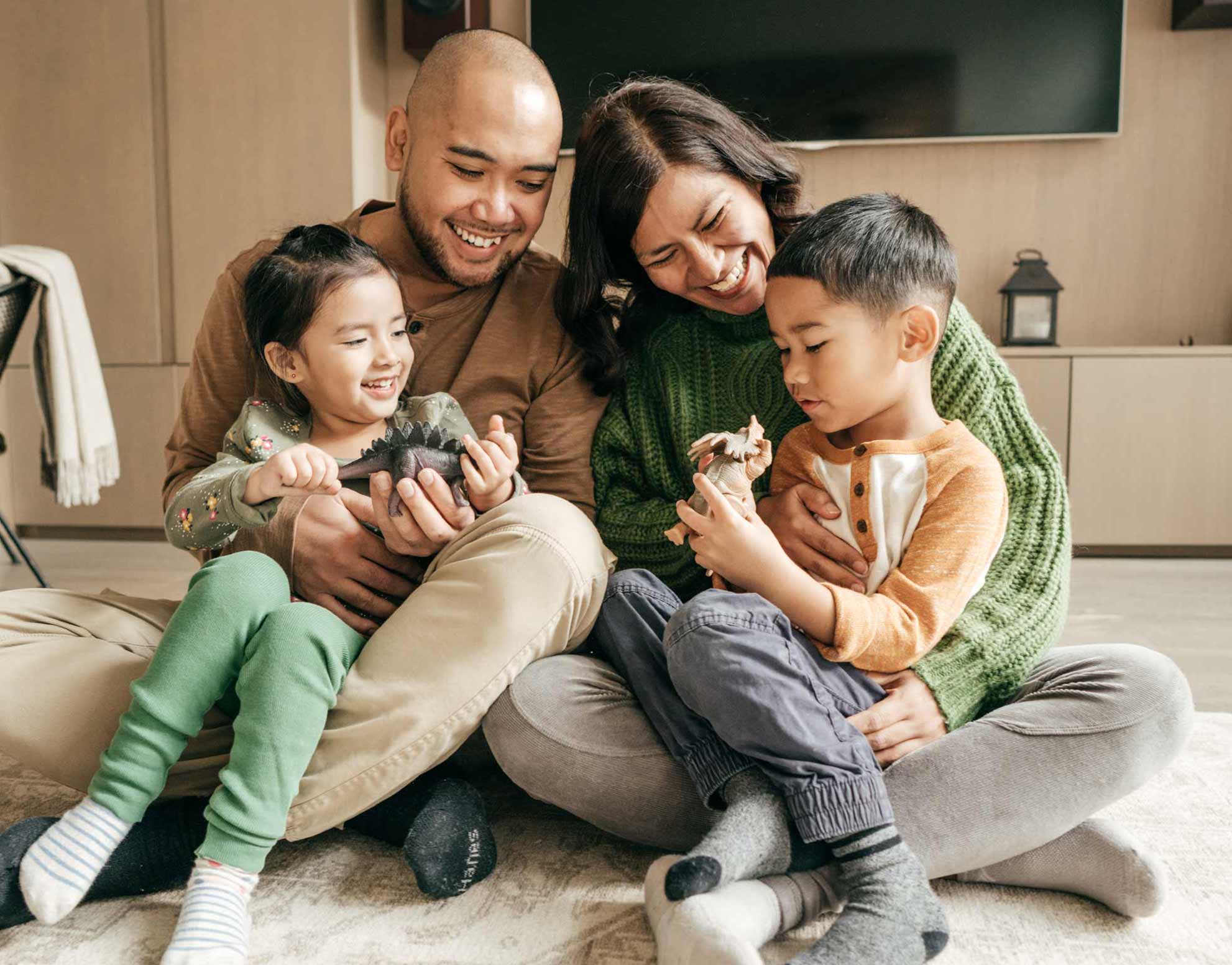 Photo of family embracing each other at their home