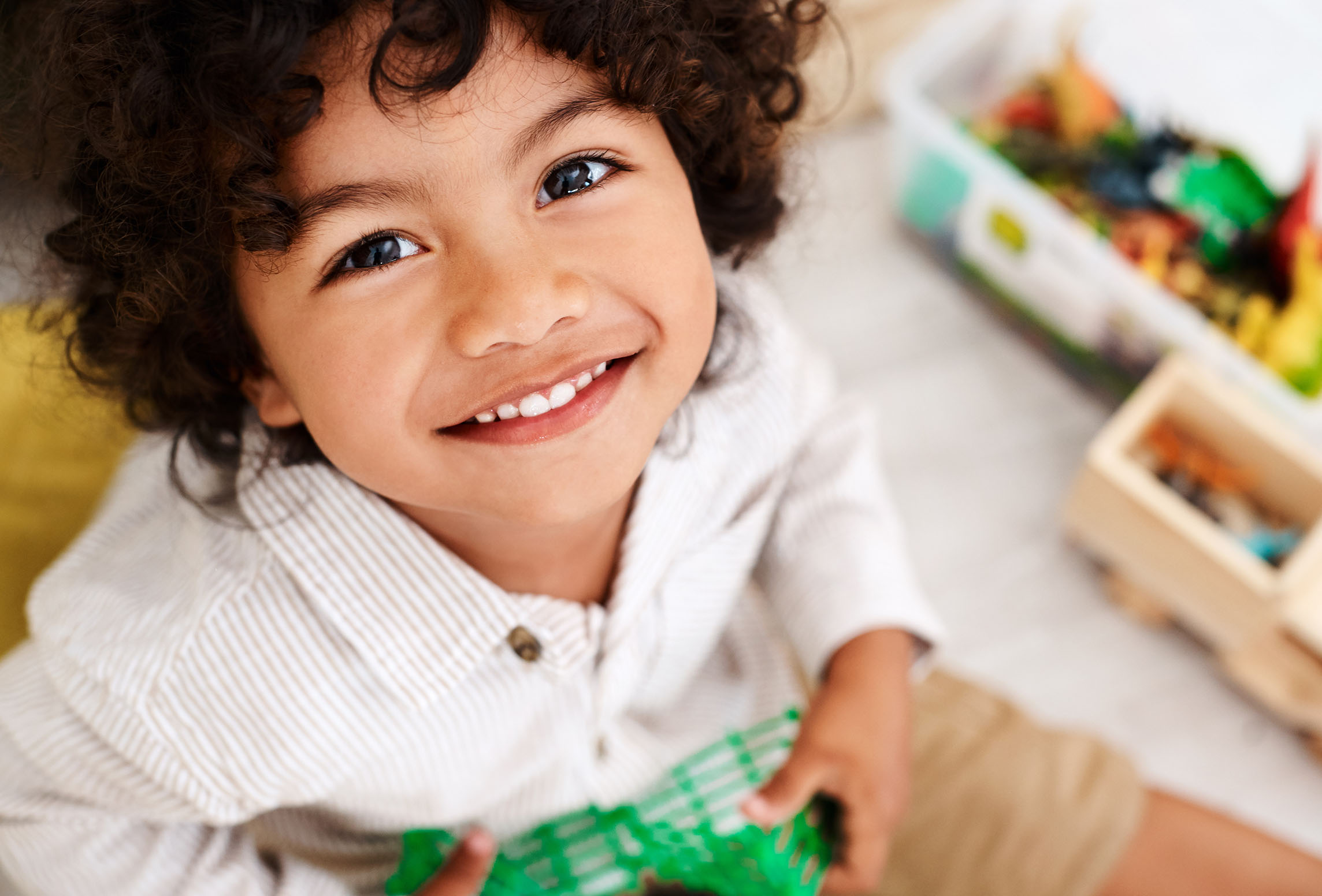 child looking up and smiling