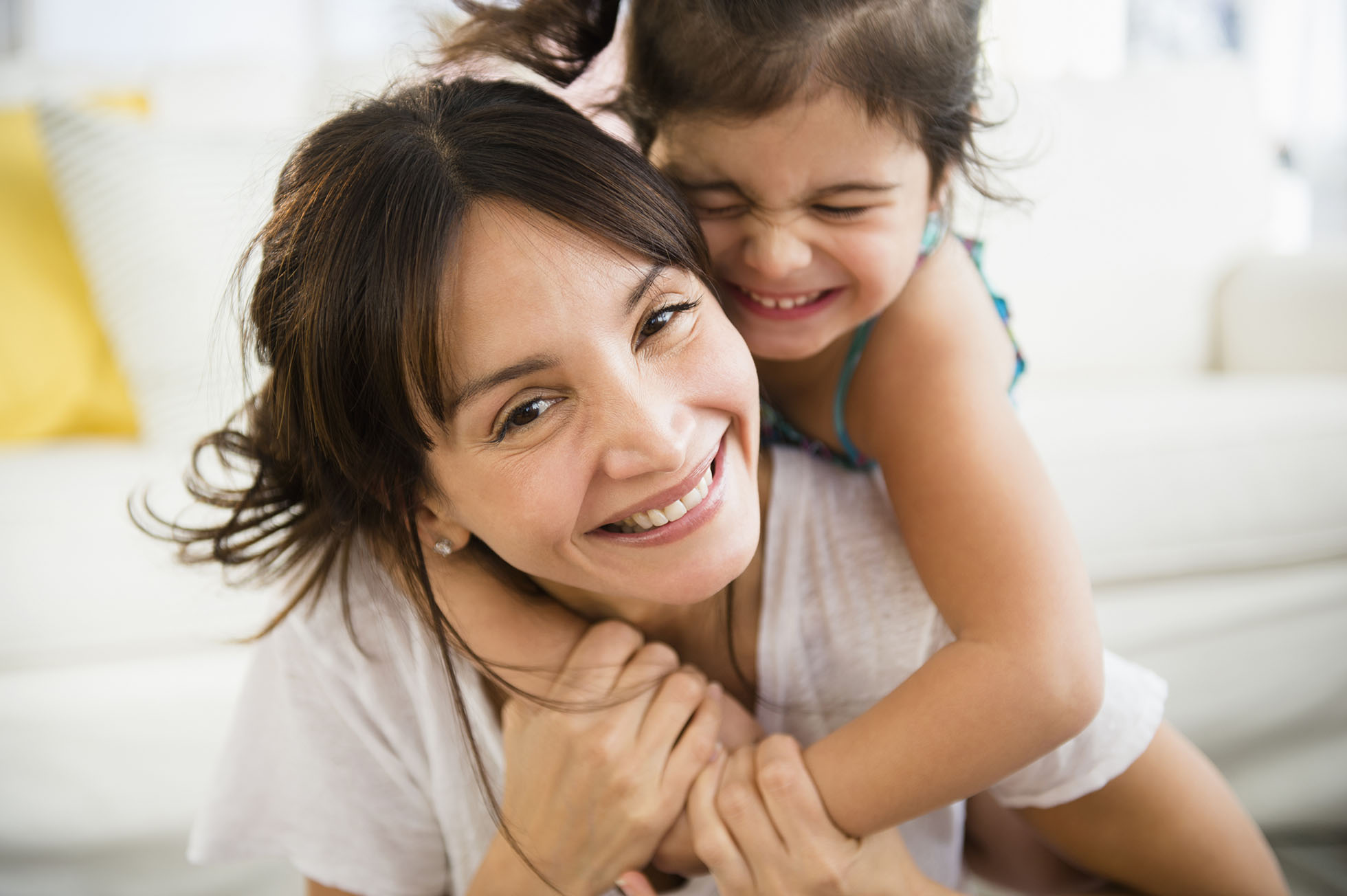 woman and daughter hugging