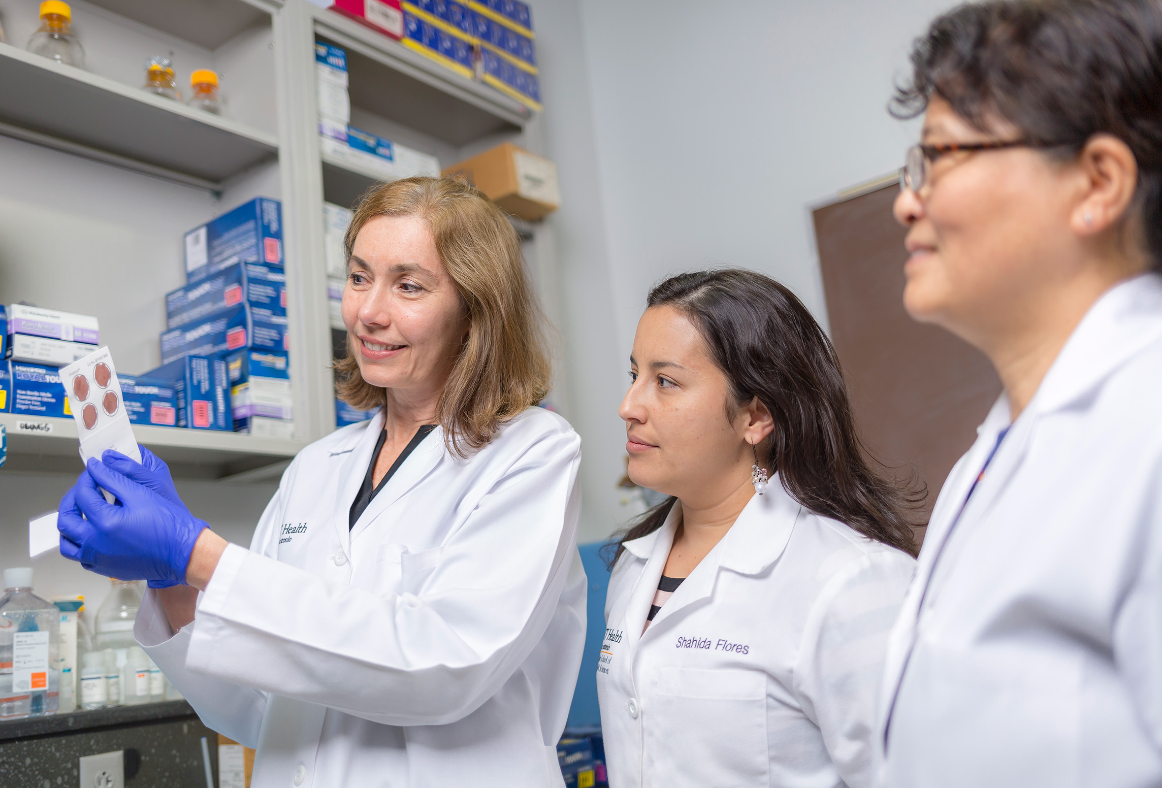 Professor teaching students in a laboratory