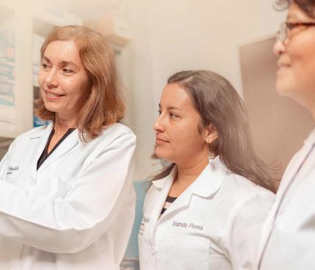 professor and students working in a lab