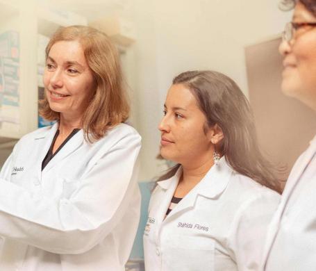 professor and students working in a lab